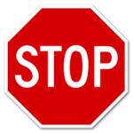 Image of a red octagonal sign with the word stop in the middle